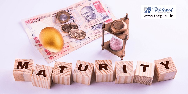 Maturity on wooden Cube with Indian currency 