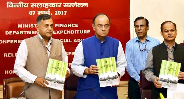 Finance Minister Arun Jaitley with Finance Secretary Ashok Lavasa (left) releasing the Revised General Financial Rules 2017 during the Conference of Financial Advisors at his office in New Delhi on Tuesday
