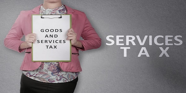 Business woman showing clipboard with Goods and services tax text. Goods and services tax concept