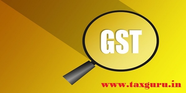 GST - Goods and Services Tax -Glass magnifier with the Goods and Service Tax acronym GST