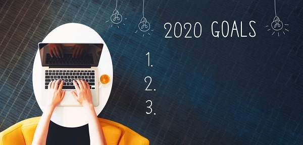 2020 goals with person using a laptop on a white table