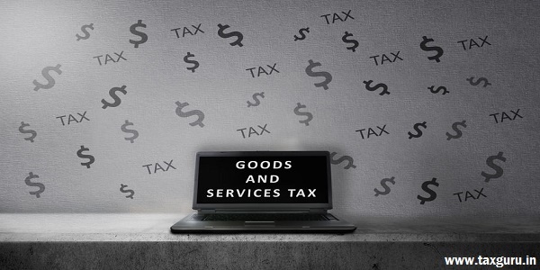 Laptop with Goods and services tax text (GST) on the screen. Goods and services tax concept