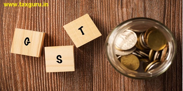 GST wordings with coins in jar