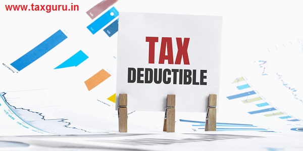 Word TAX DEDUCTIBLE made with wood building blocks