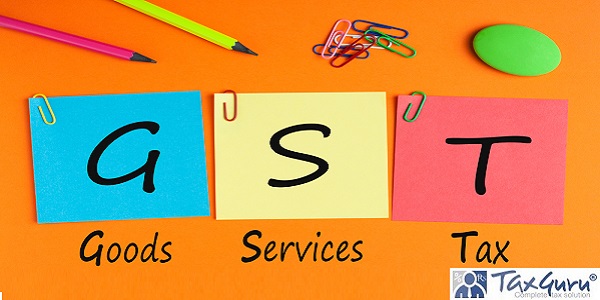 Goods Services Tax words with GST written on color notes with and office supplies
