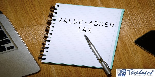 VALUE ADDED TAX - Notebook with laptop and smartphone on wooden table 