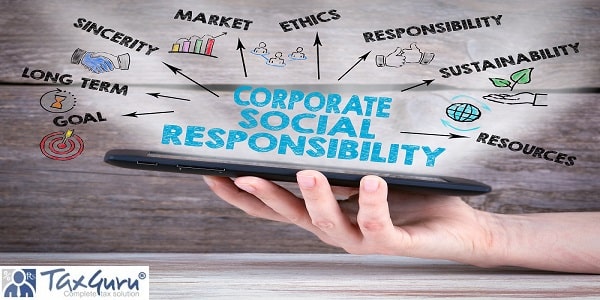 Corporate Social Responsibility Concept. Tablet computer in the hand. Old wooden background