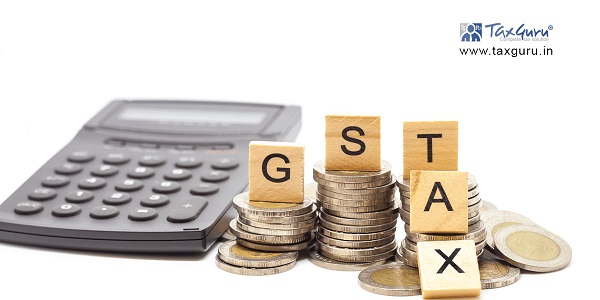 GST Tax on wooden Cube with coin and calculator 