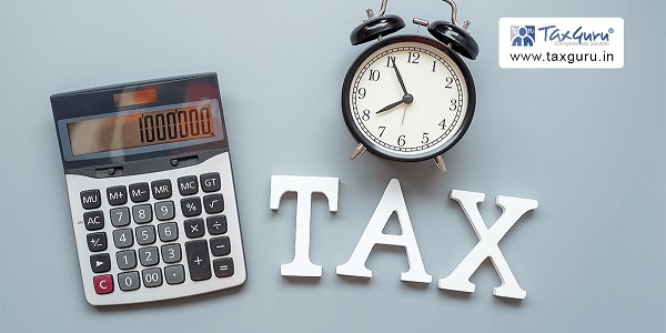 Tax word with calculator and alarm clock  