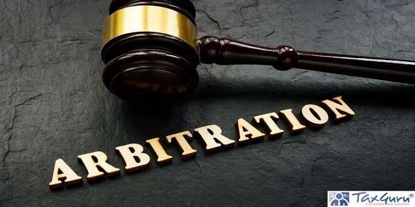 Arbitration word from wooden letters and gavel in court