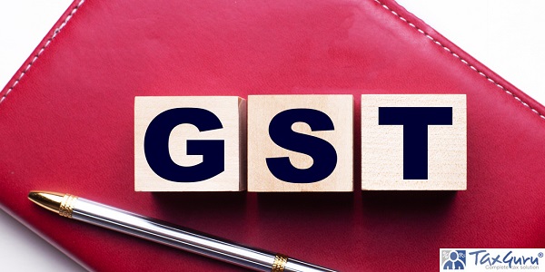 GST Goods and services tax made up of wooden cubes that stand on a burgundy notebook