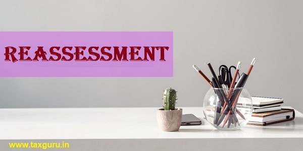 REASSESSMENT - text on the background of the office table. Business concept