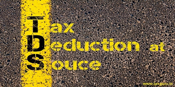TDS Tax Deduction at Source written over road marking yellow paint line