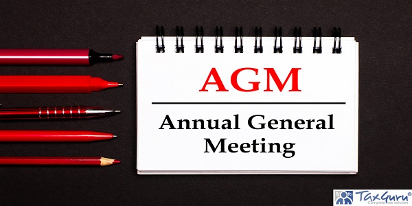 A white notepad with the text AGM Annual General Meeting