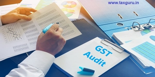 Document with title GST Audit on an office table
