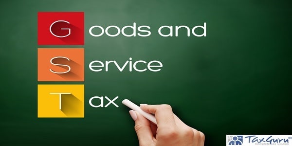 GST - Goods and Service Tax acronym, business concept background on blackboard