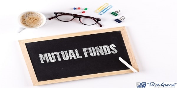 MUTUAL FUNDS word on Chalkboard with Coffee Cup, view from above