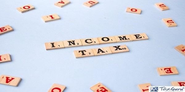 Word INCOME TAX written on wooden cubes stock image