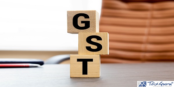 word GST on wooden block