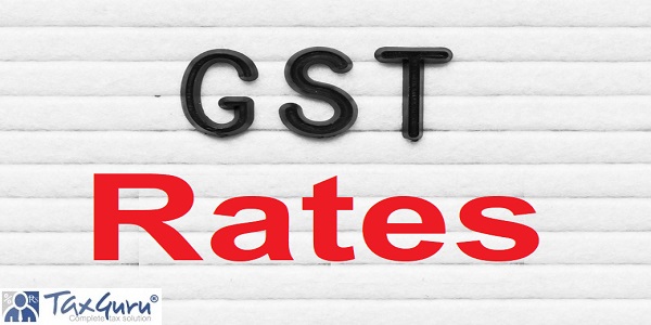 Black alphabet letter in word GST (Abbreviation of Goods and Services Tax) Rates on white felt board background