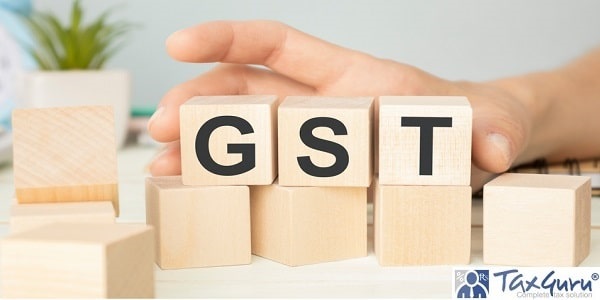 GST (Goods and service Tax) text on wooden table for your design