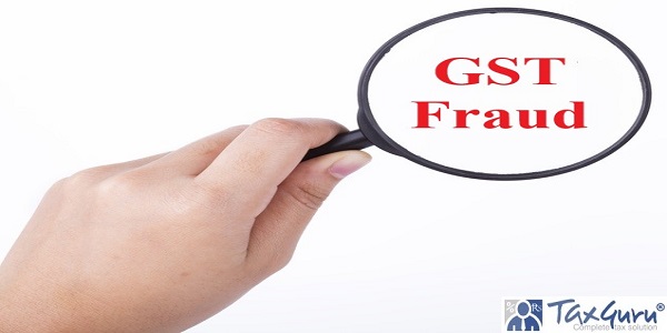 Hand showing GST fraud word through magnifying glass