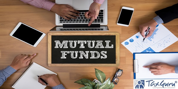 MUTUAL FUNDS Business team hands at work with financial reports and a laptop