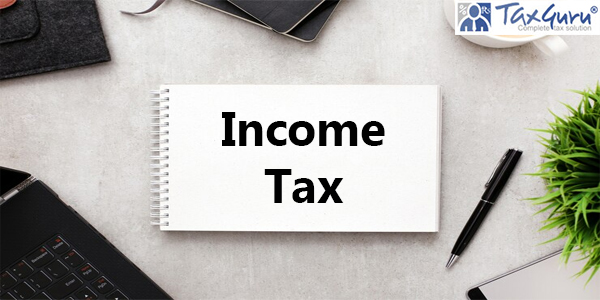 Income Tax notebook on workspace with office supplies