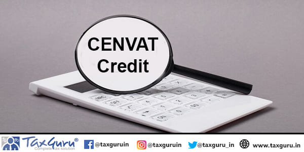 On gray background black calculator and magnifier with text CENVAT Credit