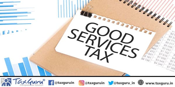 Text Good Services Tax on white paper sheet and brown paper notepad