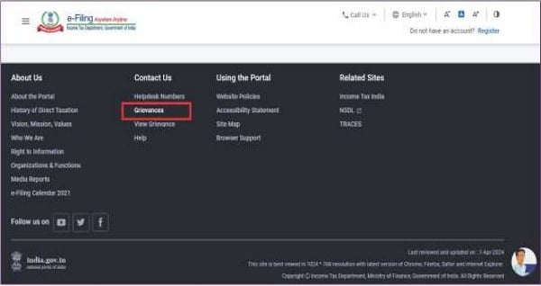 Locate the Grievance option in the footer of the webpage